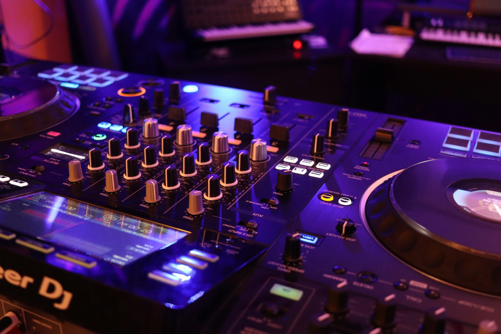 a dj's turntable and mixer in a recording studio